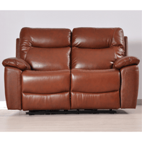 Brown leather reclining sofa on a light wooden floor with a white wall background