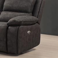 Grey recliner chair with a control panel on a wooden floor.