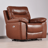 Brown leather recliner chair on a light wooden floor with a neutral wall background