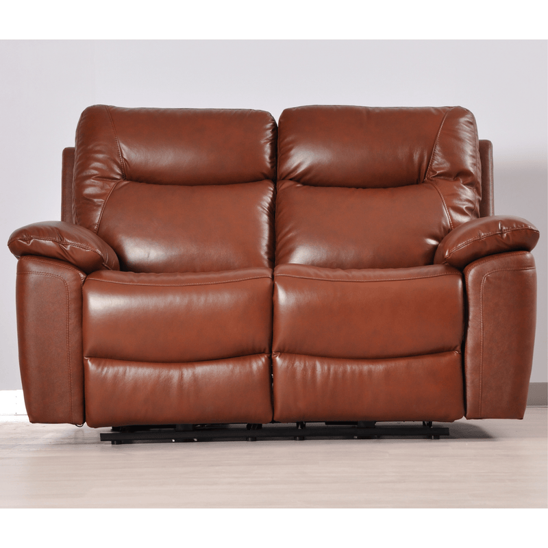 Brown leather reclining sofa on a light wooden floor with a white wall background