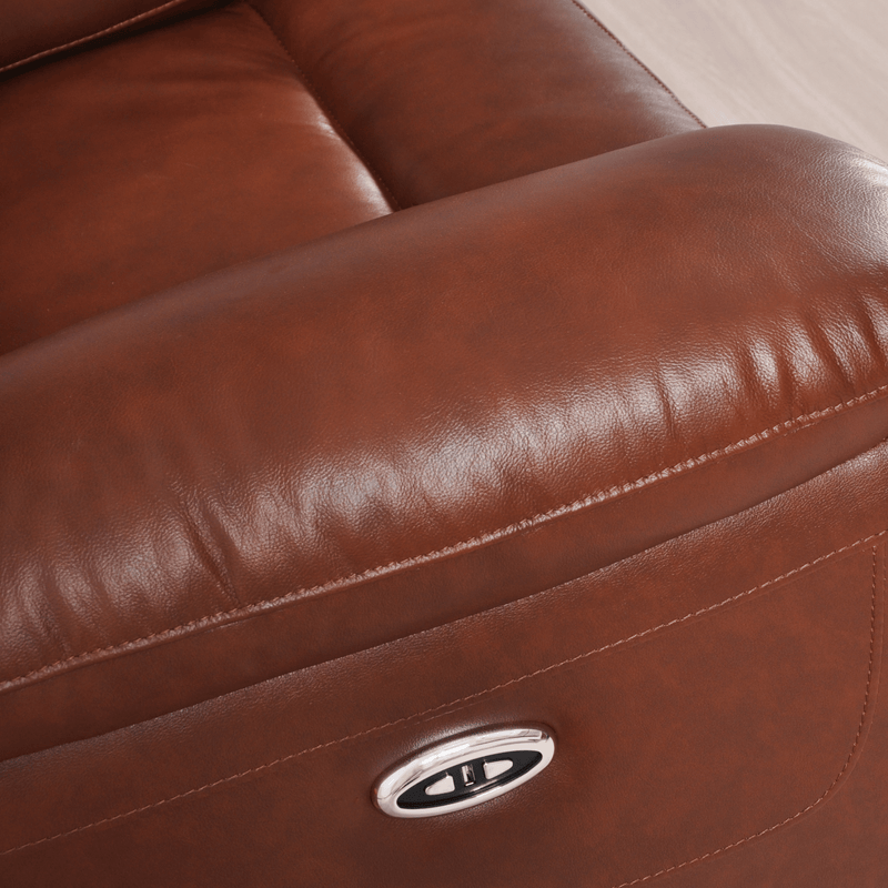 Close-up of a brown leather recliner with a visible brand logo.