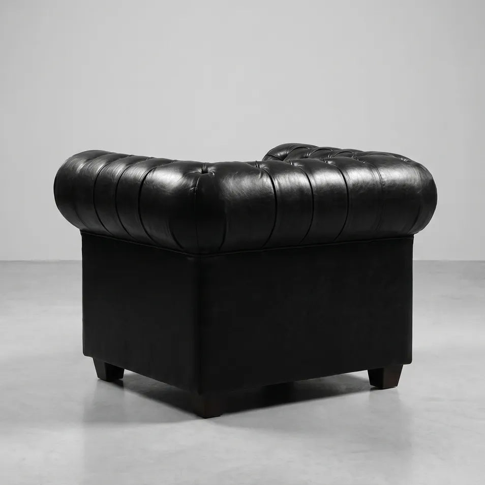 antique-black-leather-chesterfield-armchair-with-deep-buttoning