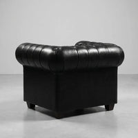antique-black-leather-chesterfield-armchair-with-deep-buttoning
