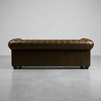 chesterfield-brown-leather-antique-3-seater-sofa-3-3-seater-sofa-set-side-close-corner-angle-texture-grain-stitched-hand-craftsmanship-timeless-style-collection-effect-statement-piece-accent-instore-tufted