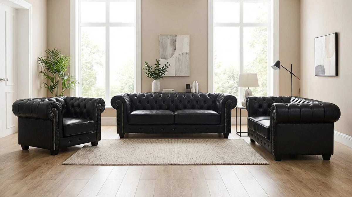 Black Chesterfield leather sofa set styled in a living room