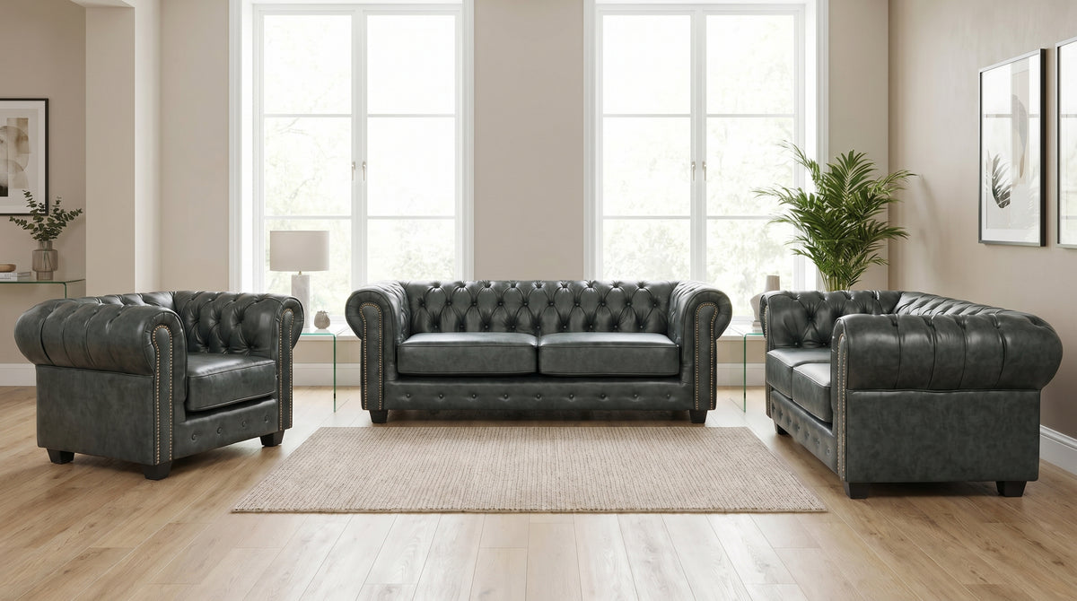Green Chesterfield leather sofa set styled in a living room