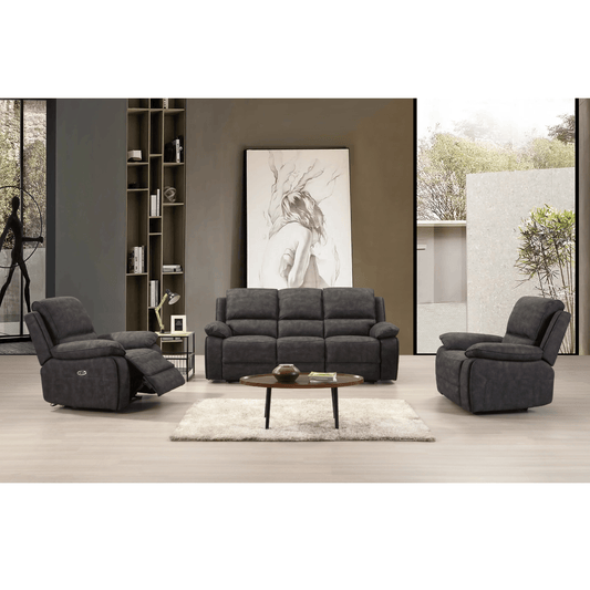 Grey sofa set in a modern living room with a bookshelf and artwork.