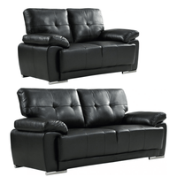 Sienna black leather contemporary sofa set lifestyle image - Furniture Instore